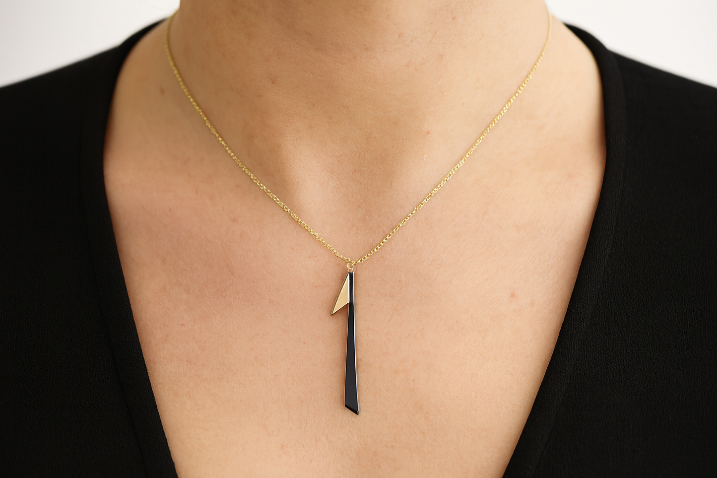 Elegant geometric necklace being worn