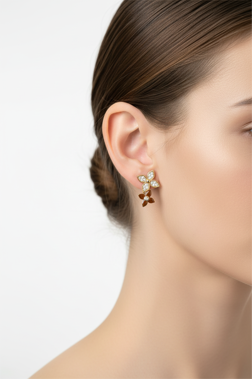 Gold butterfly earrings properly sized on model