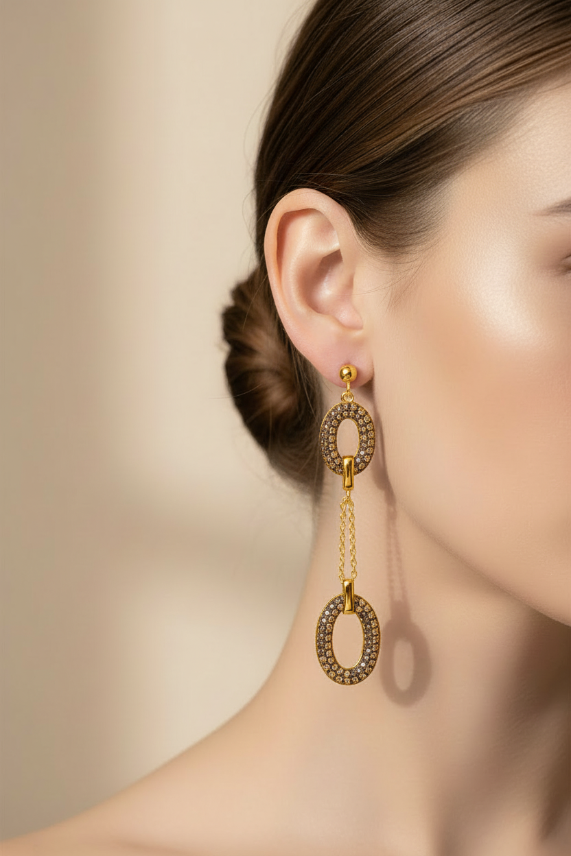 Gold chain link earrings on model