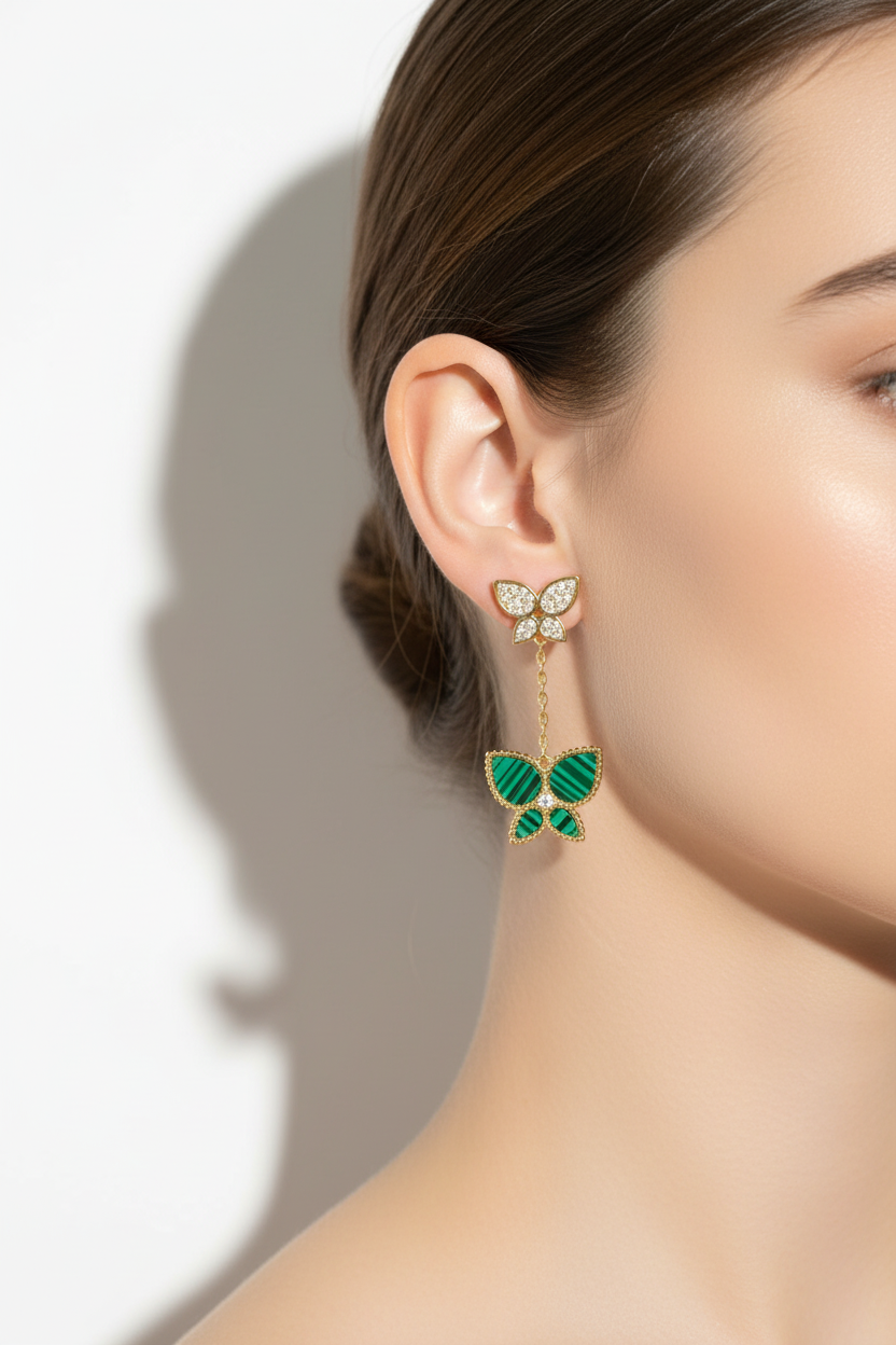 Malachite butterfly drop earrings on model ear