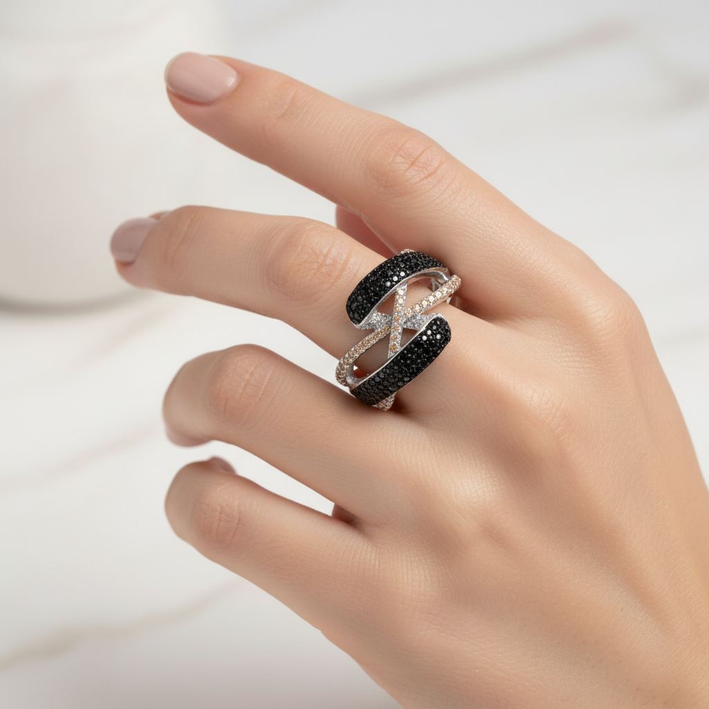 Silver twisted crossover ring on finger