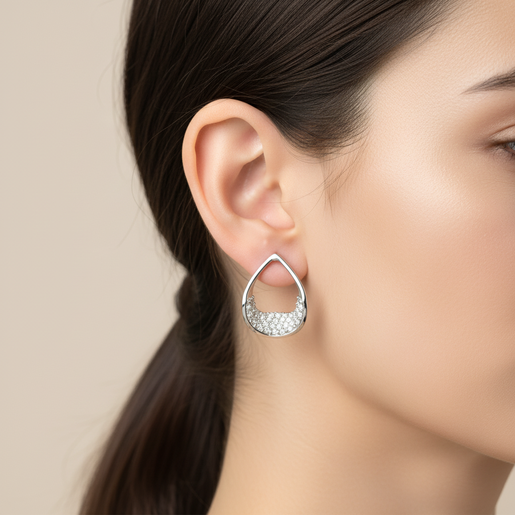 Teardrop earrings on model ear