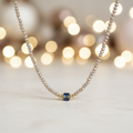 Beige taupe beaded necklace with elegant background