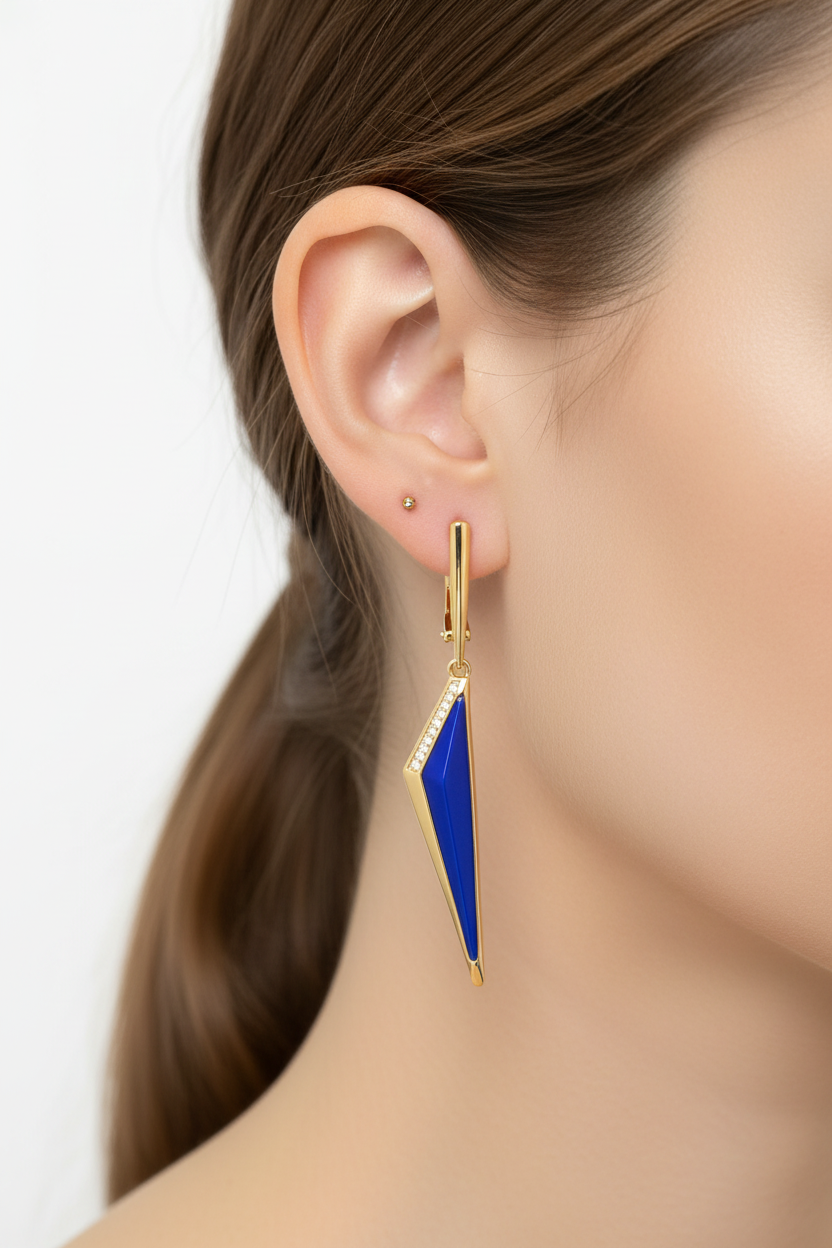 Blue enamel geometric drop earrings worn on ear
