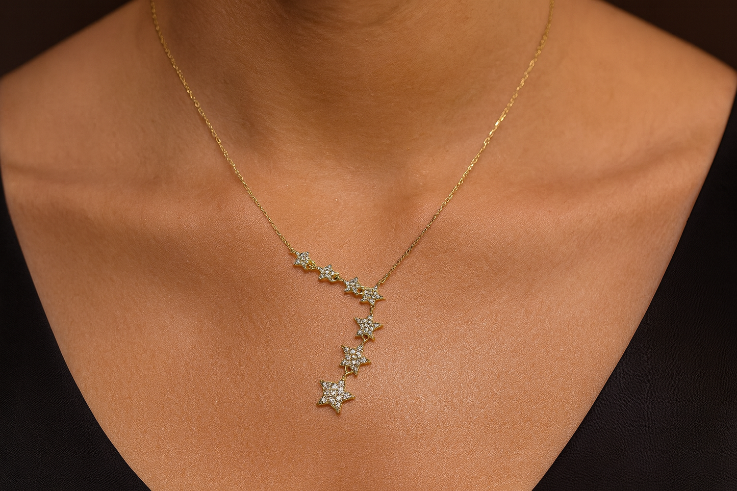 Cascading crystal star necklace being worn
