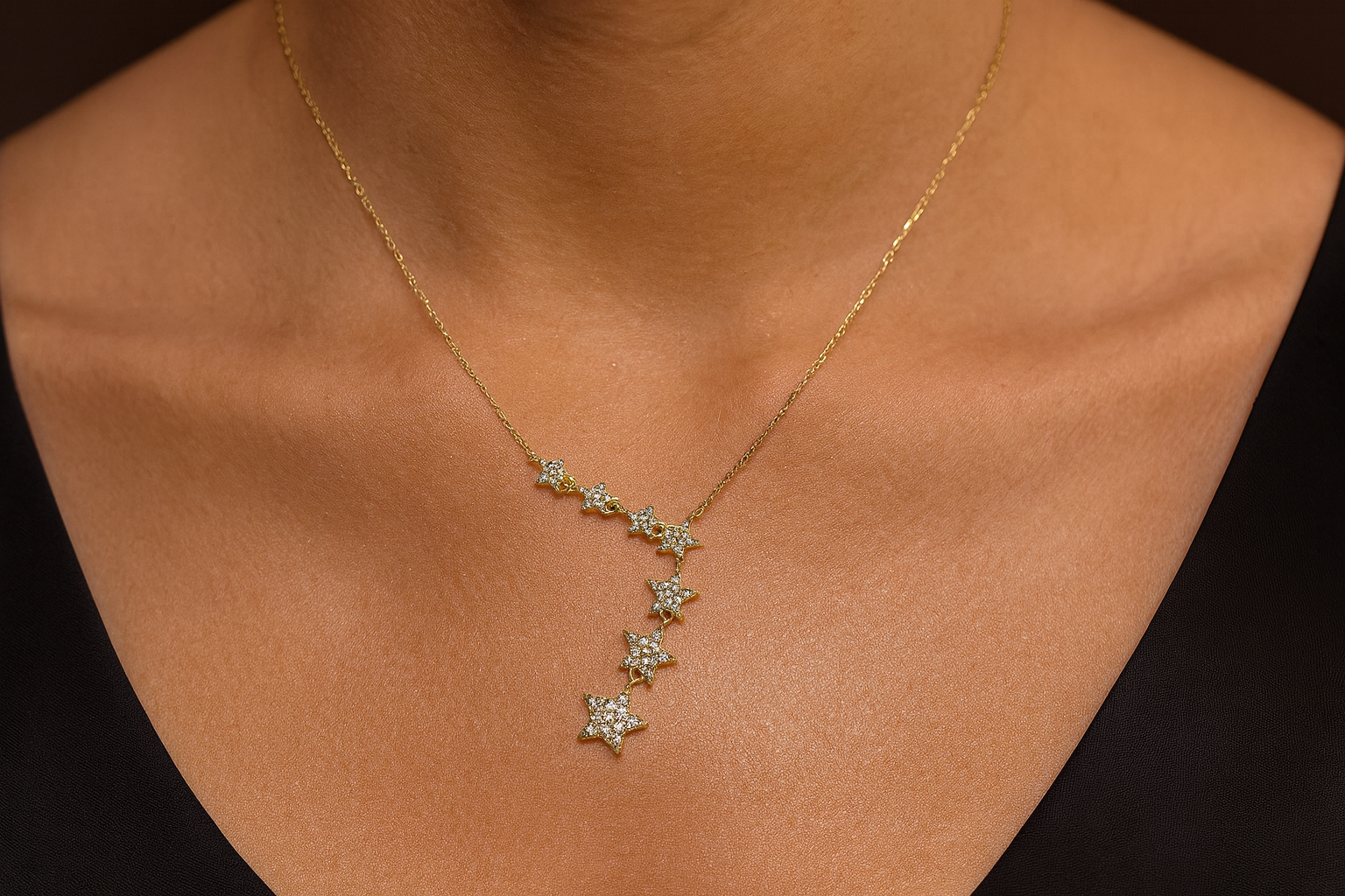 Cascading crystal star necklace being worn