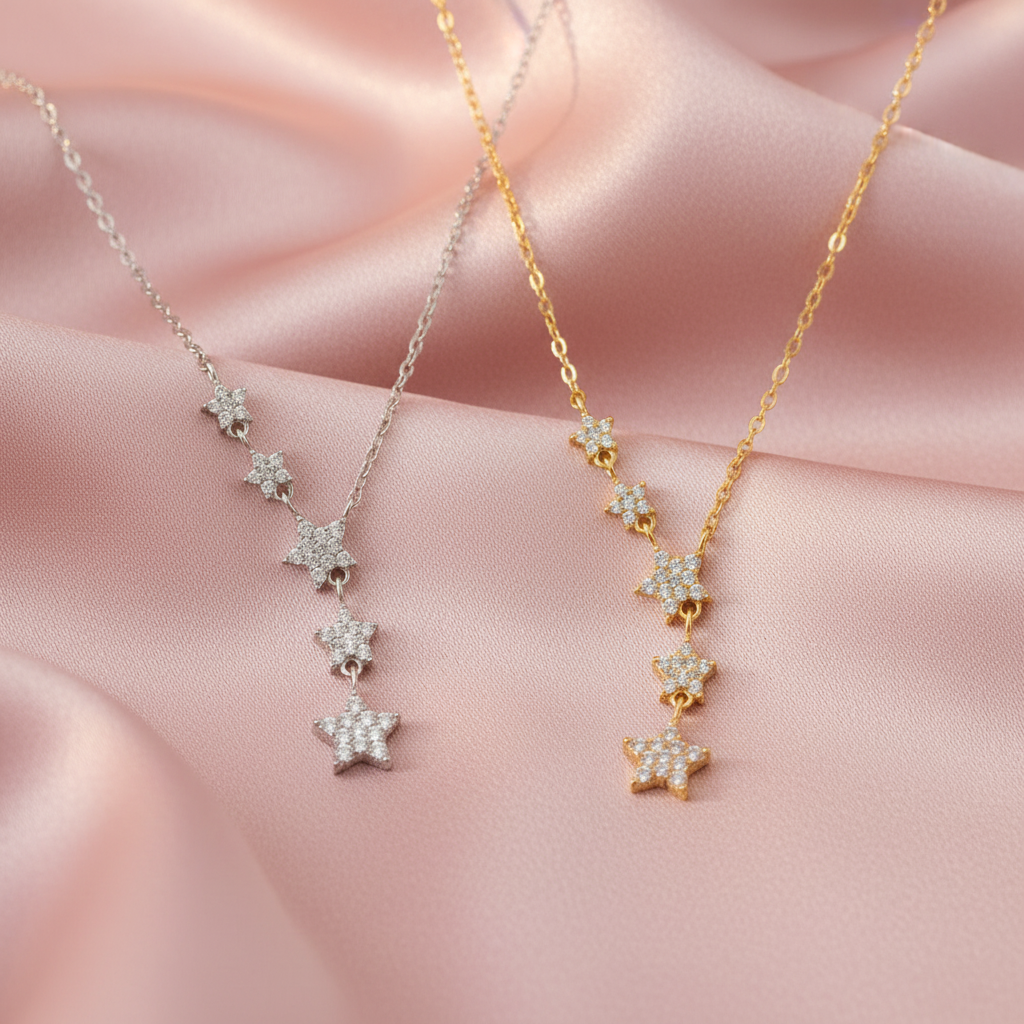 Cascading Star Necklace Gold & Silver on Blush Pink