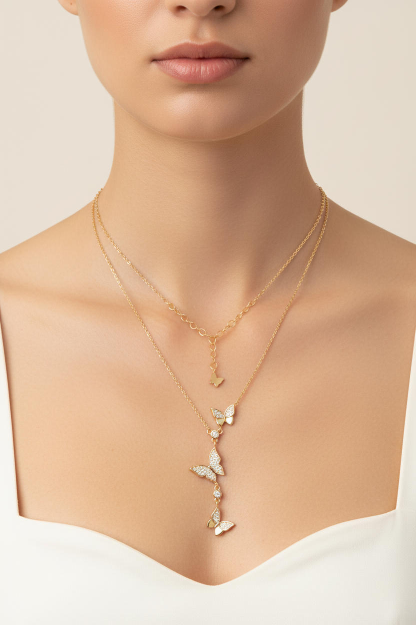 Gold butterfly lariat necklace on model