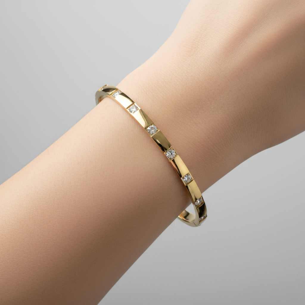 Gold crystal bangle worn on wrist