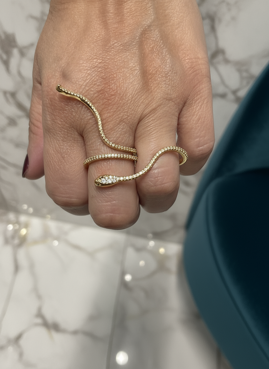 Gold snake ring with elegant background