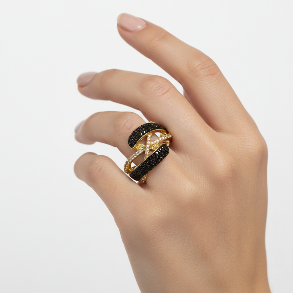 Gold twisted crossover ring on finger