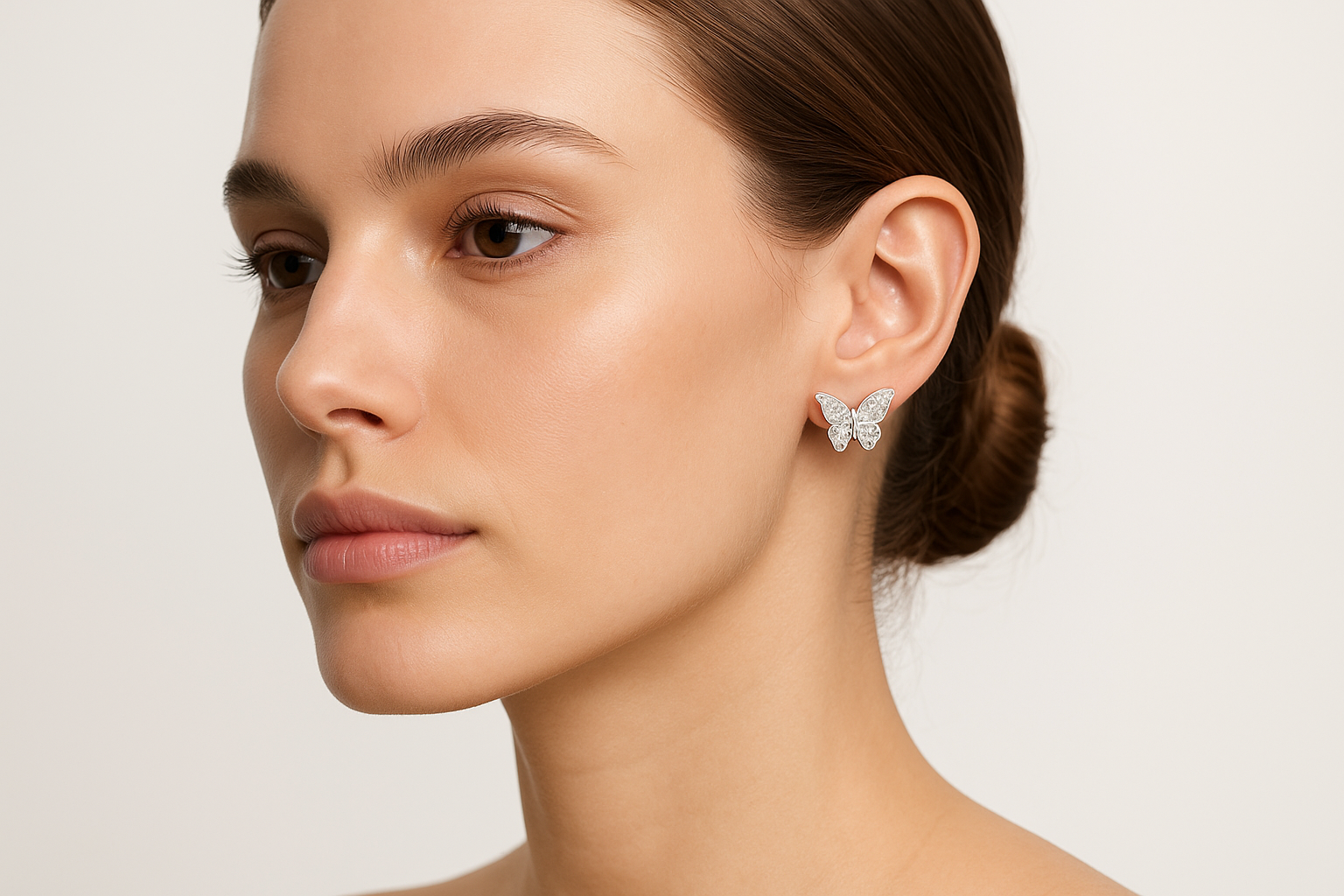 Model wearing Luxe Flight butterfly stud earrings