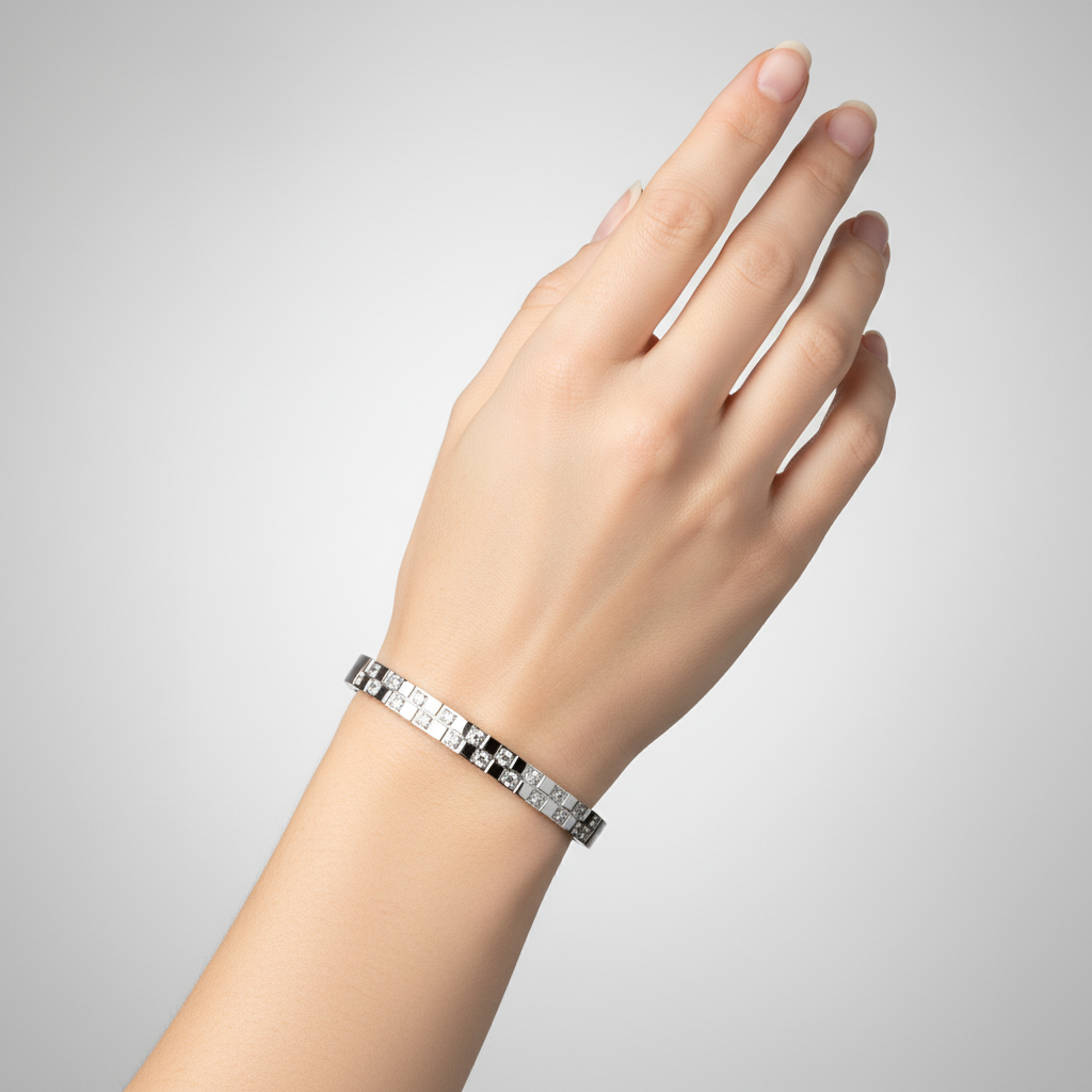 Silver bangle with crystal pattern on model hand