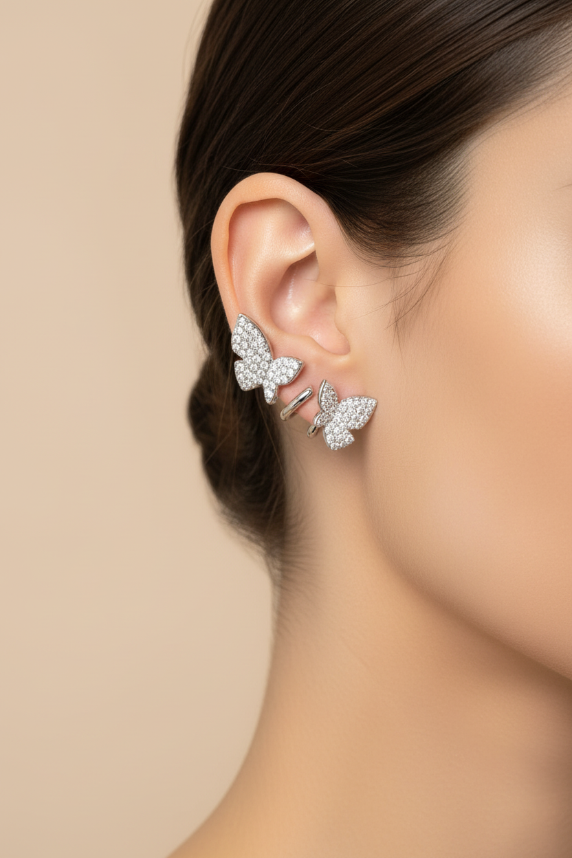 Silver butterfly earrings on model - small size