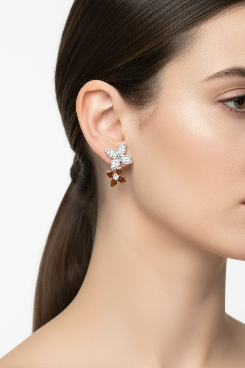 Silver butterfly earrings worn on ear