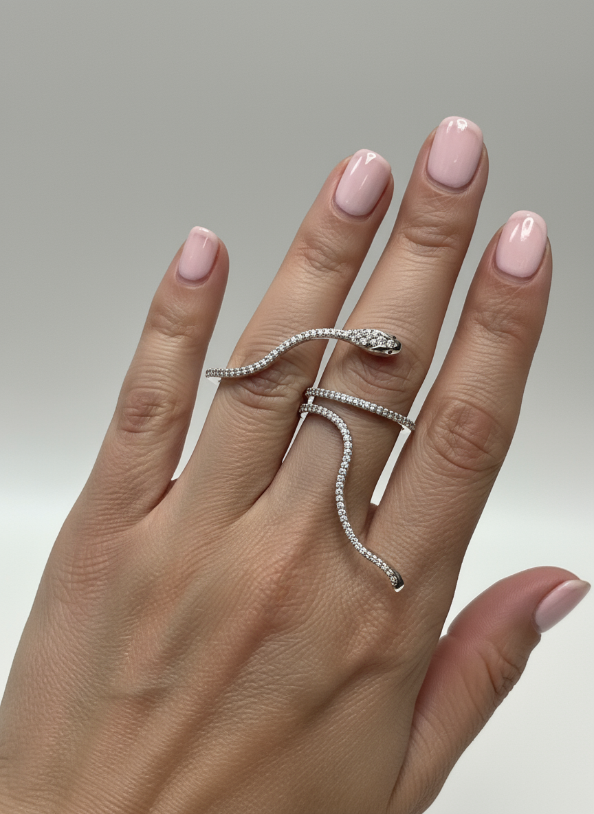 Snake ring on elegant manicured hand