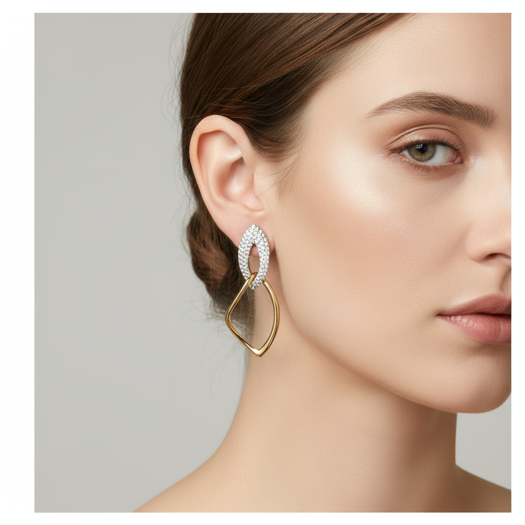 Two-tone drop earrings on model ear